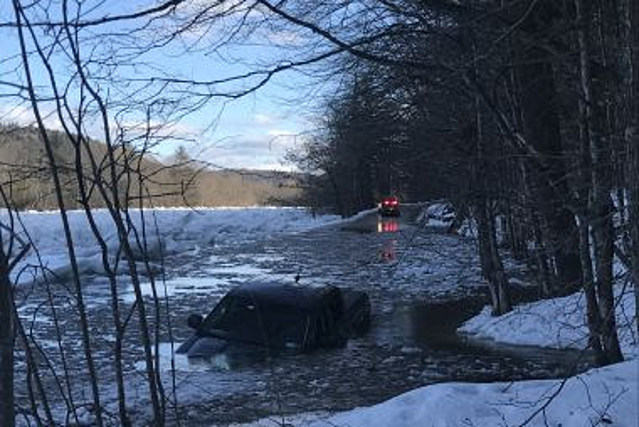 New York Driver Rescued After Truck Ends Up In Icy River, Photos